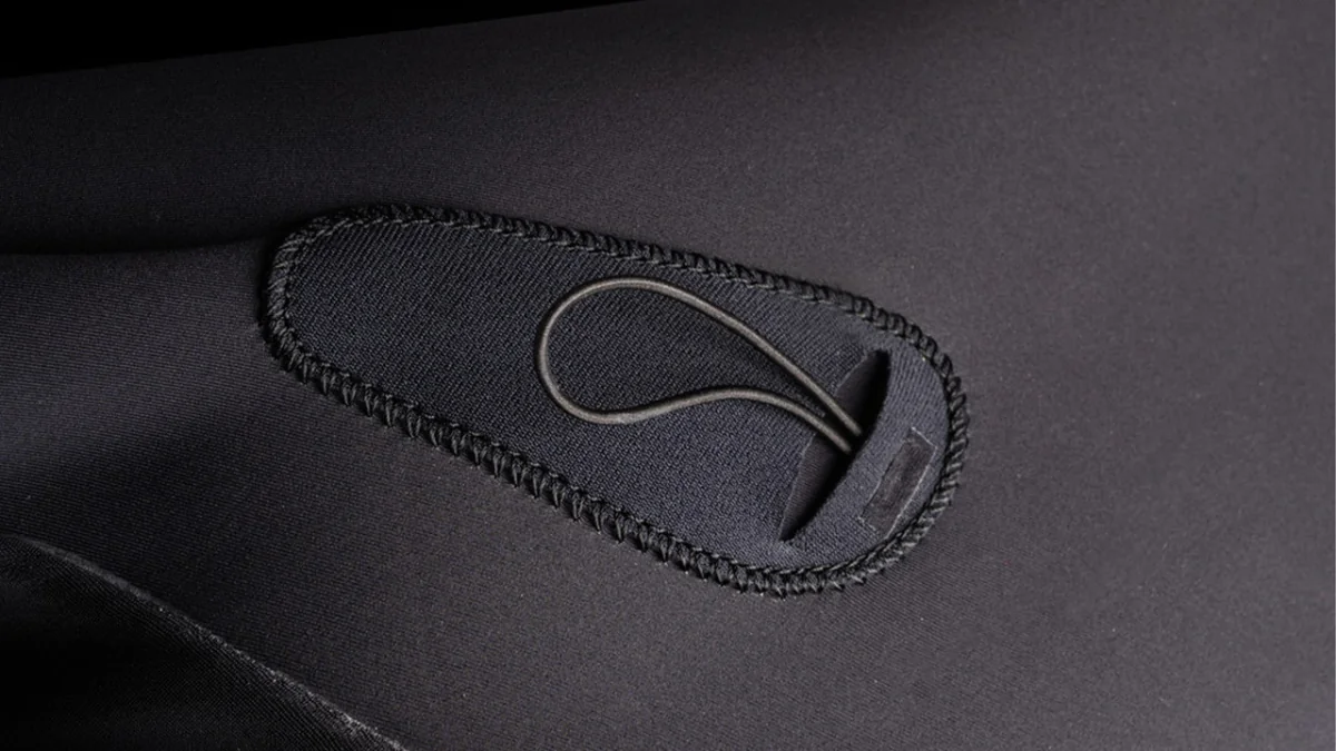 The One Fullsuit 5/3mm Zipfree — Hidden key pocket in chest panel
